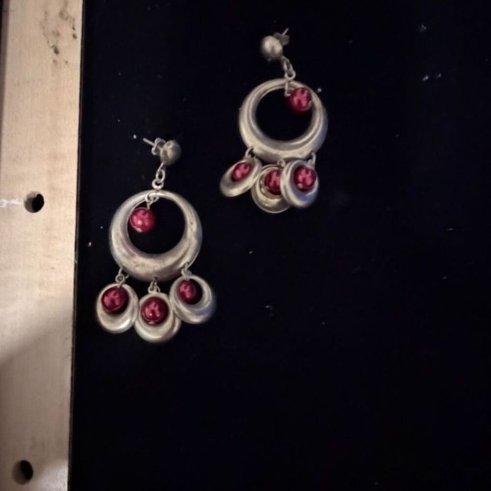 gold tone metal hoop earrings with red ball accents